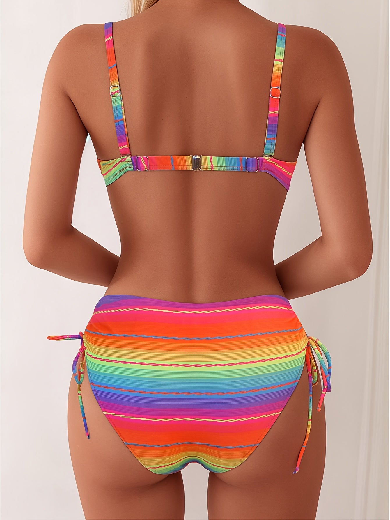 Two-Piece Swimsuit with a Drawstring Design, Featuring a Colorful Striped Hard-Shell Top And Pants.